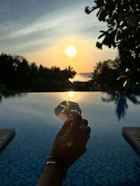 Relaxing on the beach with palm trees and clear waters at Mnemba Island, Zanzibar.
