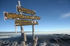 Successful Kilimanjaro summit at Uhuru Peak with mountain views