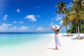White sandy beach in Zanzibar with turquoise waters under a sunny sky