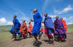 Local Maasai village near Mount Kilimanjaro showing traditional life, dances, and the mountain in the background.