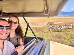 Safari photographer capturing wildlife in Serengeti during an 8-day Northern Circuit safari with Nelwen Tours and Safari